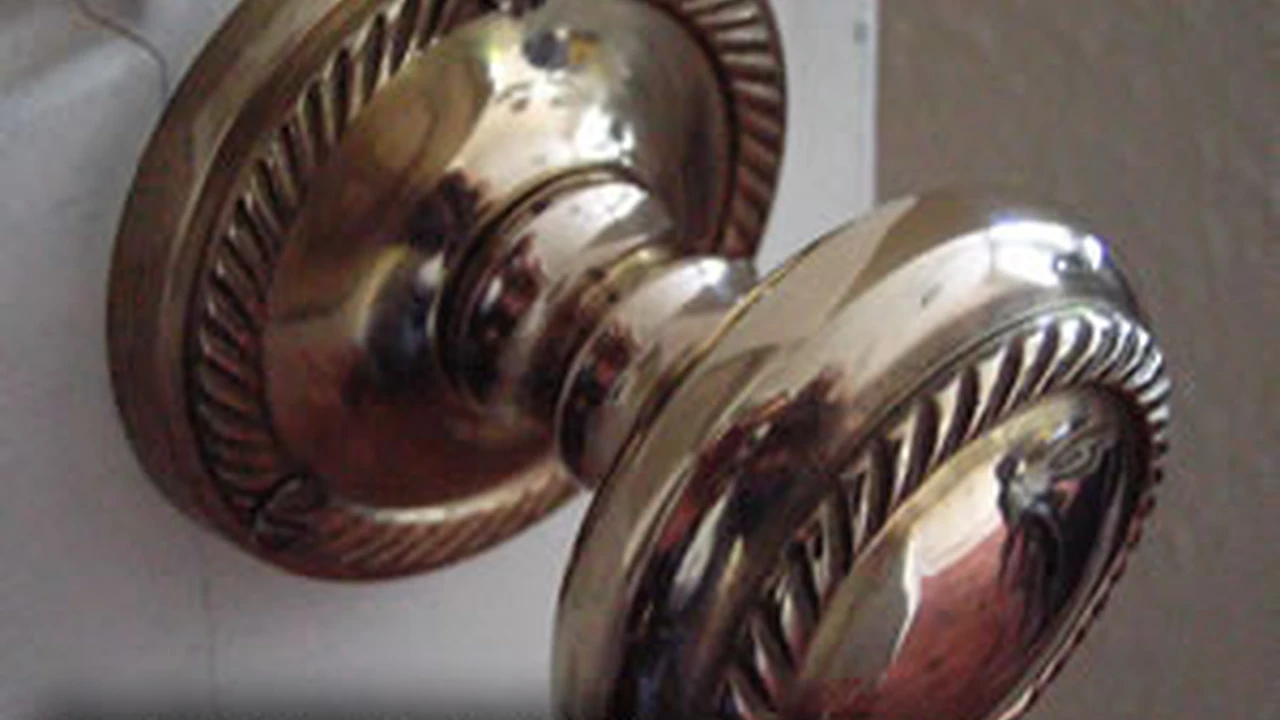 Two mint chocolate milkshakes with whipped cream and green sprinkles.