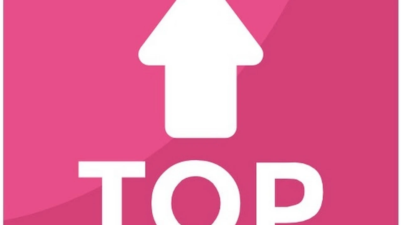 Close up on a plate of mashed potatoes, topped with baked pork chops with cream of mushroom soup, and a side of green beans.